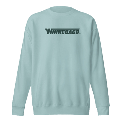 Image of a light blue crewneck with the Winnebago logo on the front and a landscape illustration on the back